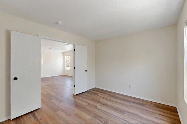9927 Silverton Dr NW, Albuquerque, NM 87114 - empty room featuring light wood-type flooring and baseboards