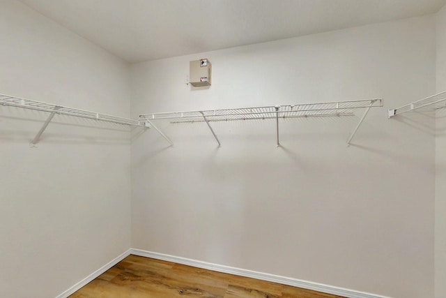 9927 Silverton Dr NW, Albuquerque, NM 87114 - spacious closet featuring wood finished floors