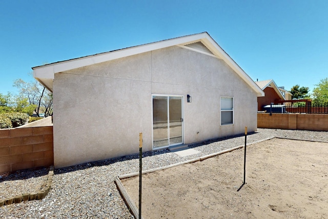9927 Silverton Dr NW, Albuquerque, NM 87114 - back of property featuring a fenced backyard, stucco siding, and a patio
