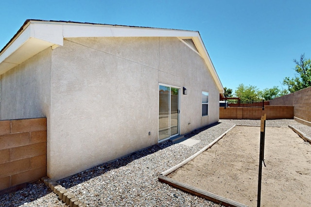 9927 Silverton Dr NW, Albuquerque, NM 87114 - back of property featuring a fenced backyard and stucco siding