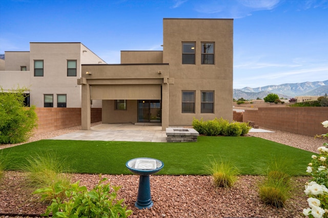 801 Horned Owl Dr NE, Albuquerque, NM 87122 - back of property with a patio area, stucco siding, and a mountain view