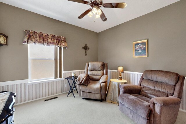 10320 Durham St NW, Albuquerque, NM 87114 - living area featuring carpet flooring, a ceiling fan, and wainscoting