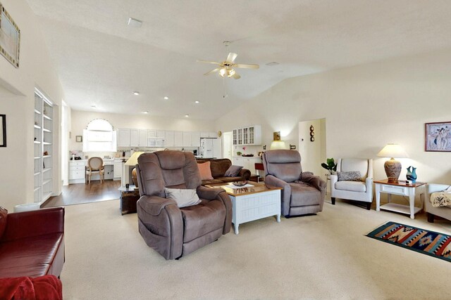 10320 Durham St NW, Albuquerque, NM 87114 - living area featuring light carpet, ceiling fan, and vaulted ceiling