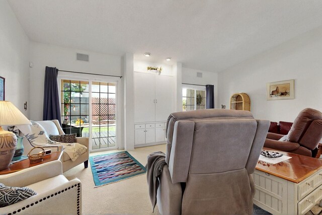 10320 Durham St NW, Albuquerque, NM 87114 - living room featuring carpet floors and lofted ceiling