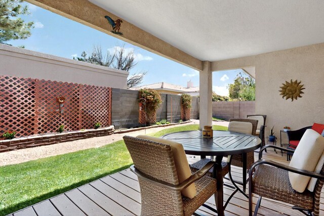10320 Durham St NW, Albuquerque, NM 87114 - deck with a fenced backyard and outdoor dining area