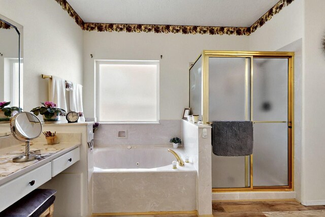 10320 Durham St NW, Albuquerque, NM 87114 - bathroom featuring a stall shower, vanity, a tub with jets, and wood finished floors