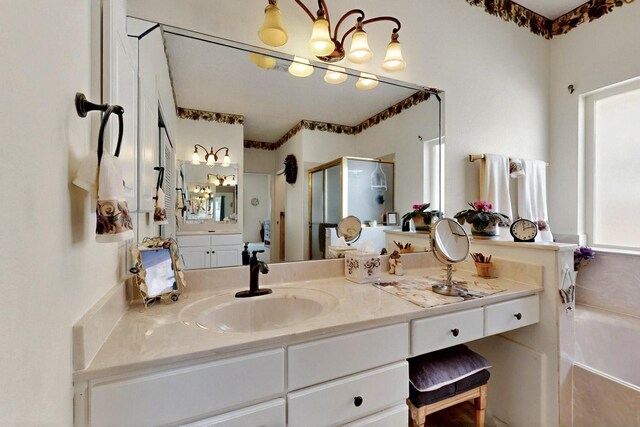 10320 Durham St NW, Albuquerque, NM 87114 - full bath featuring a chandelier, a stall shower, vanity, and a garden tub