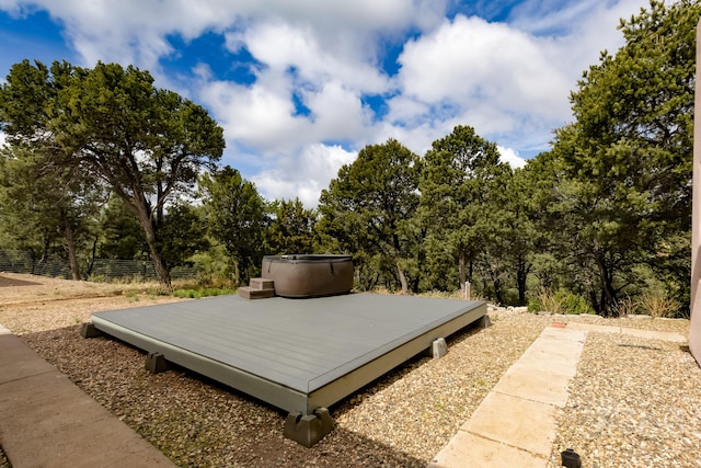 13 Asher Ln, Tijeras, NM 87059 - deck featuring a hot tub and view of scattered trees