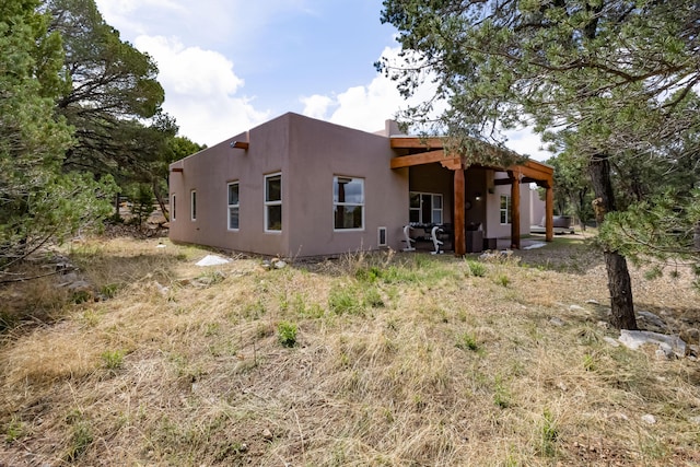 13 Asher Ln, Tijeras, NM 87059 - rear view of property featuring stucco siding