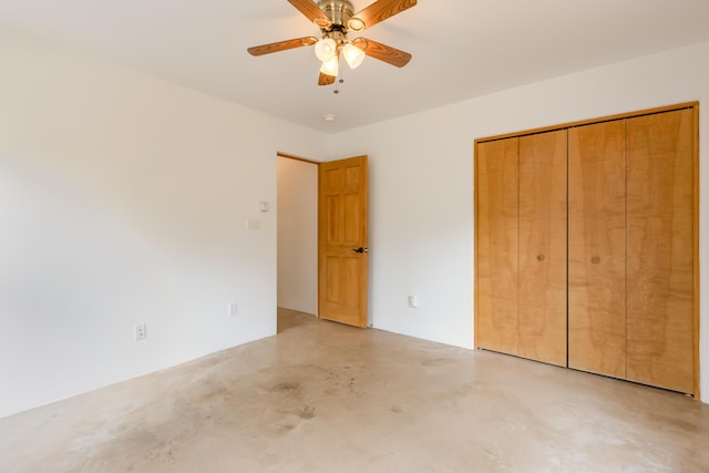 13 Asher Ln, Tijeras, NM 87059 - unfurnished bedroom with concrete flooring, a closet, and ceiling fan