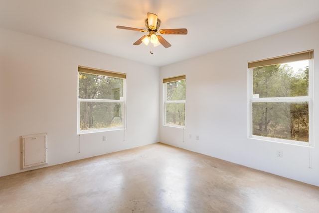 13 Asher Ln, Tijeras, NM 87059 - empty room featuring ceiling fan and concrete floors
