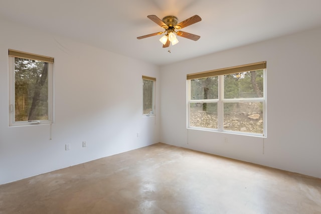 13 Asher Ln, Tijeras, NM 87059 - spare room featuring a ceiling fan and concrete floors