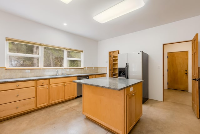 13 Asher Ln, Tijeras, NM 87059 - kitchen featuring stainless steel dishwasher, a sink, white refrigerator with ice dispenser, a kitchen island, and tasteful backsplash
