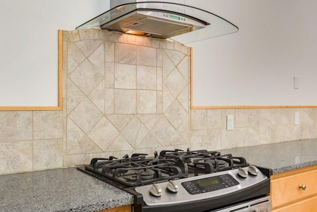 13 Asher Ln, Tijeras, NM 87059 - kitchen with stainless steel gas stove, extractor fan, and backsplash