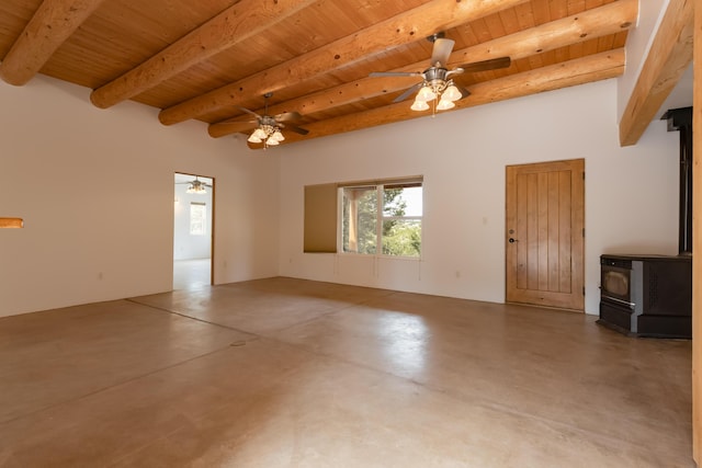13 Asher Ln, Tijeras, NM 87059 - empty room featuring a wood stove, wood ceiling, finished concrete flooring, beam ceiling, and ceiling fan