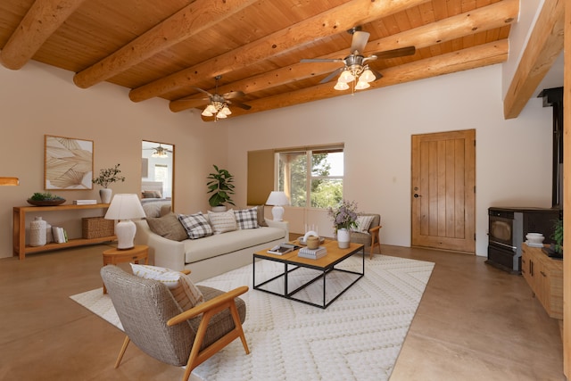 13 Asher Ln, Tijeras, NM 87059 - living room with wood ceiling, a wood stove, concrete floors, ceiling fan, and beamed ceiling