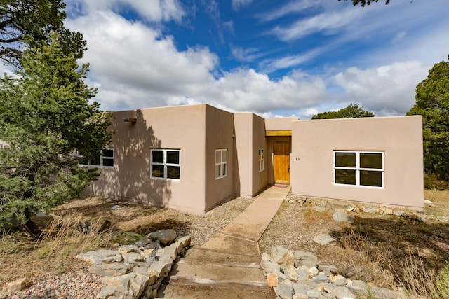 13 Asher Ln, Tijeras, NM 87059 - pueblo-style house with stucco siding