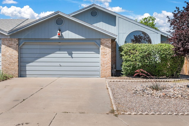 1905 Gomez Dr SW, Los Lunas, NM 87031 - ranch-style house featuring brick siding, an attached garage, and concrete driveway