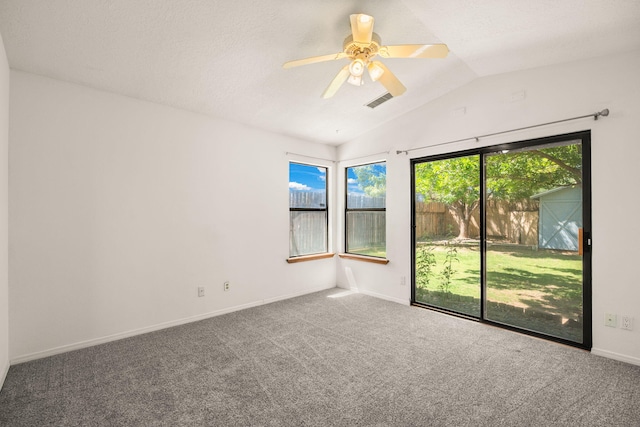 1905 Gomez Dr SW, Los Lunas, NM 87031 - spare room with vaulted ceiling, carpet floors, a ceiling fan, and baseboards