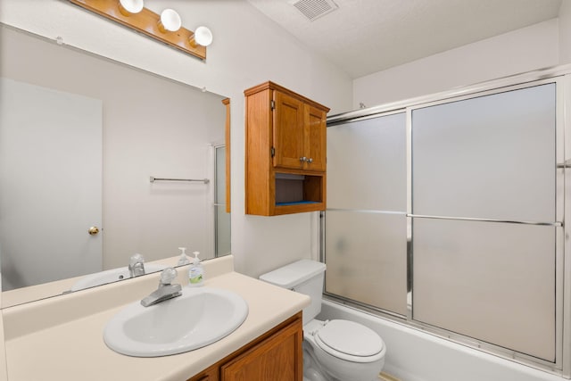 1905 Gomez Dr SW, Los Lunas, NM 87031 - bathroom with vanity, toilet, and combined bath / shower with glass door