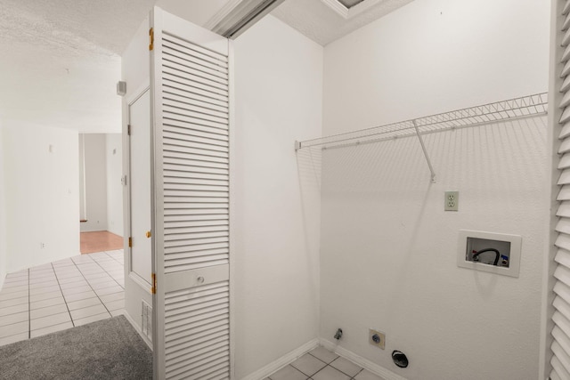 1905 Gomez Dr SW, Los Lunas, NM 87031 - washroom with light tile patterned flooring, hookup for a washing machine, hookup for an electric dryer, and baseboards
