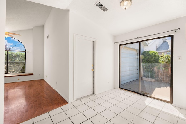 1905 Gomez Dr SW, Los Lunas, NM 87031 - empty room featuring light wood-style flooring and lofted ceiling