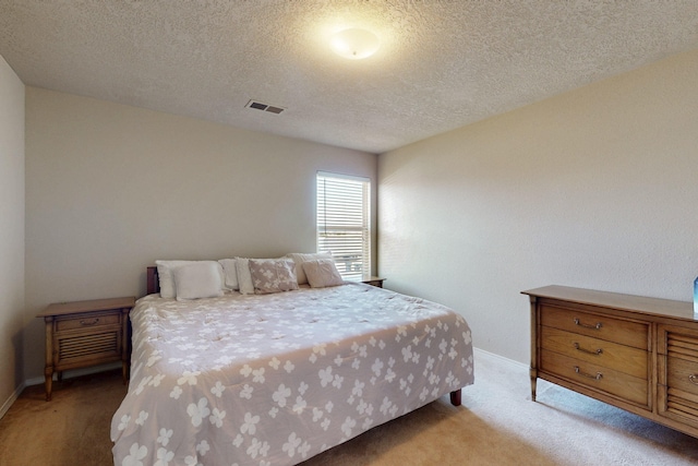 1723 Avenida Real, Albuquerque, NM 87105 - bedroom with light colored carpet, baseboards, and a textured ceiling