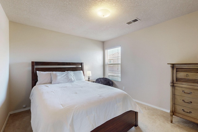 1723 Avenida Real, Albuquerque, NM 87105 - bedroom featuring light colored carpet, a textured ceiling, and baseboards