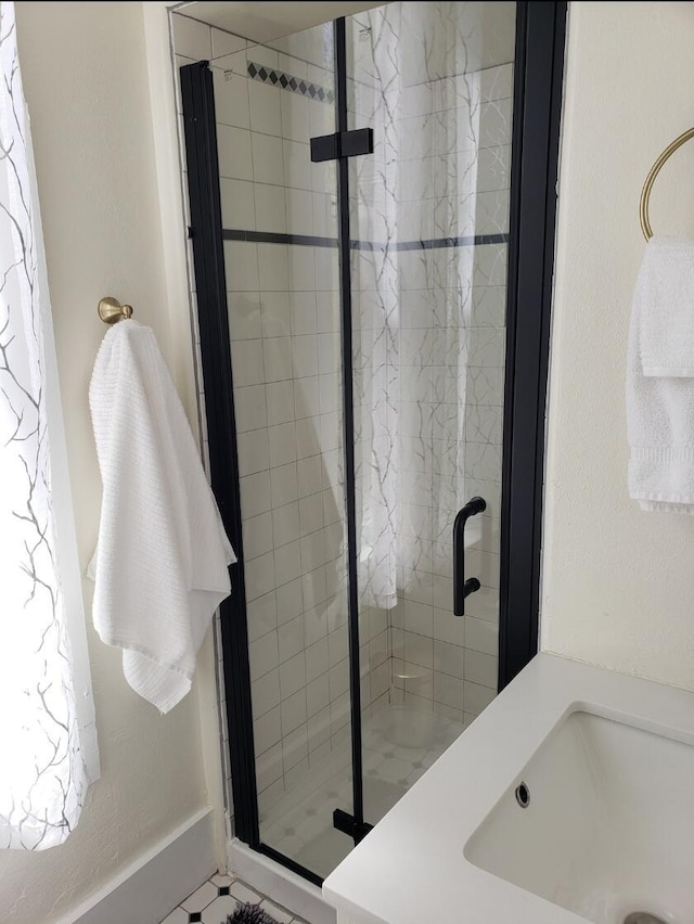 223 14th St NW, Albuquerque, NM 87104 - bathroom featuring a stall shower and a sink