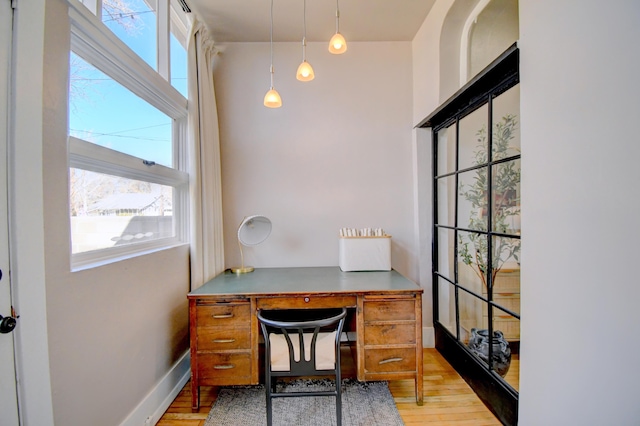 223 14th St NW, Albuquerque, NM 87104 - office area with light wood-style flooring and baseboards