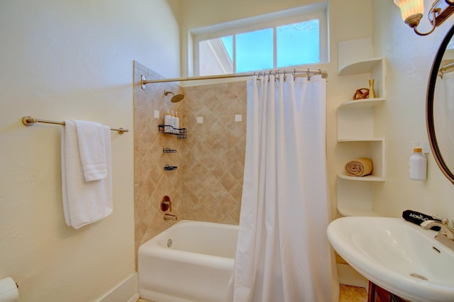 223 14th St NW, Albuquerque, NM 87104 - bathroom with a sink, built in shelves, shower / bath combination with curtain, and baseboards