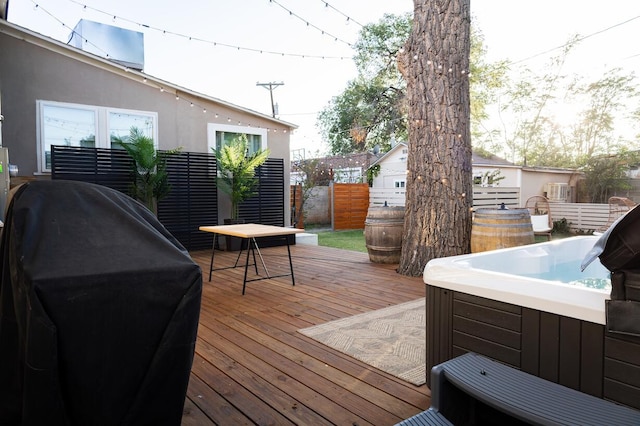 223 14th St NW, Albuquerque, NM 87104 - wooden deck with a hot tub and grilling area