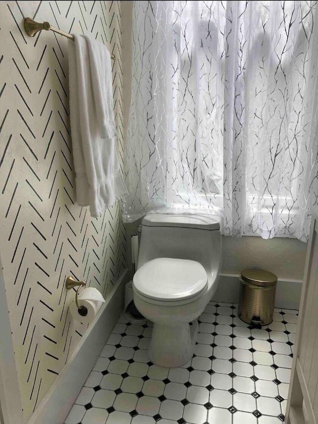 223 14th St NW, Albuquerque, NM 87104 - bathroom featuring tile patterned floors and toilet