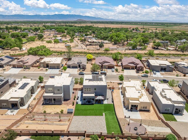 1661 Camino Culiacan, Los Lunas, NM 87031 - aerial view of residential area featuring a mountain backdrop