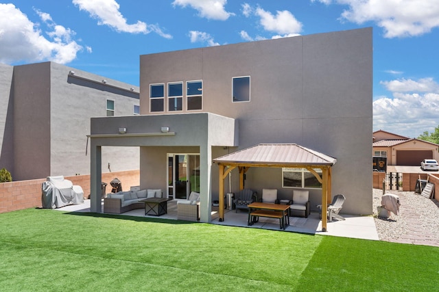 1661 Camino Culiacan, Los Lunas, NM 87031 - back of house with an outdoor living space, a gazebo, a patio, a yard, and stucco siding