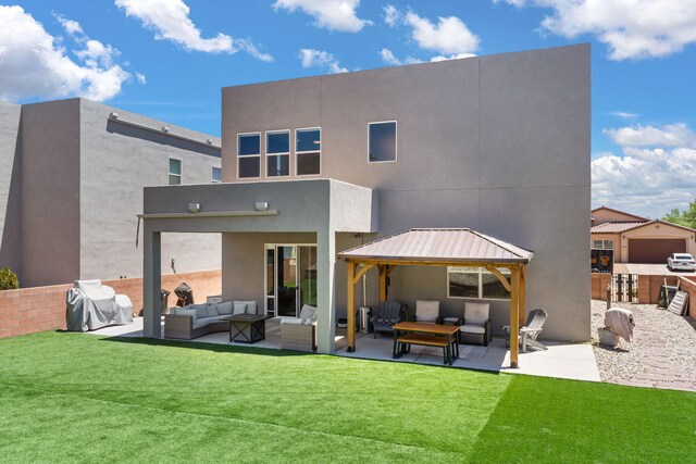 1661 Camino Culiacan, Los Lunas, NM 87031 - rear view of house featuring an outdoor hangout area, a gazebo, a patio, and stucco siding