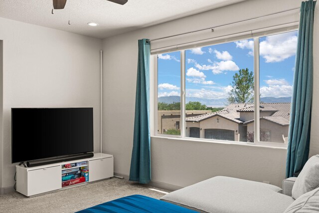 1661 Camino Culiacan, Los Lunas, NM 87031 - carpeted bedroom with a textured ceiling, baseboards, and a ceiling fan