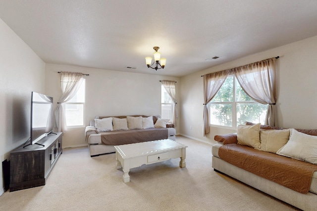 525 Peaceful Meadows Dr NE, Rio Rancho, NM 87144 - living room featuring a chandelier, light carpet, and baseboards