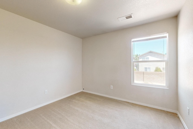 525 Peaceful Meadows Dr NE, Rio Rancho, NM 87144 - spare room with light carpet and baseboards