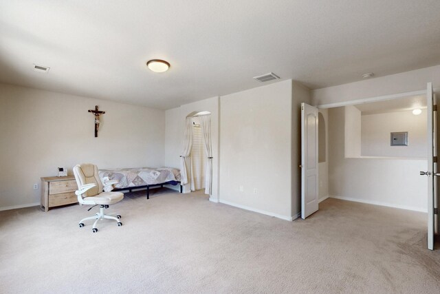 525 Peaceful Meadows Dr NE, Rio Rancho, NM 87144 - sitting room featuring arched walkways, light carpet, baseboards, and electric panel