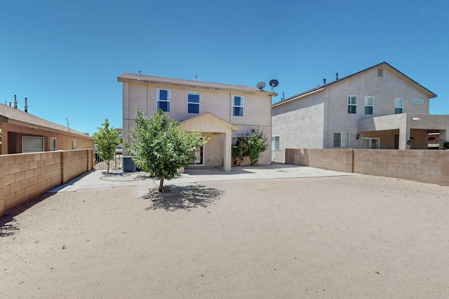 525 Peaceful Meadows Dr NE, Rio Rancho, NM 87144 - back of property featuring stucco siding and central AC unit