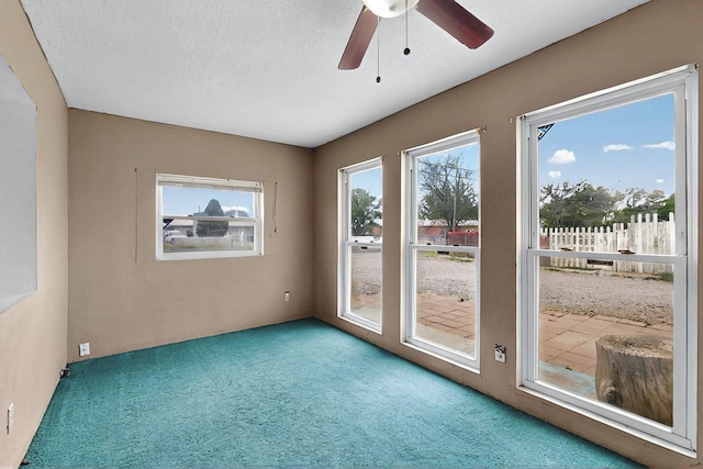 1237 Gabaldon Rd, Belen, NM 87002 - carpeted empty room with a ceiling fan