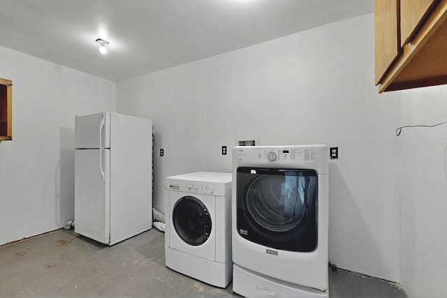 1237 Gabaldon Rd, Belen, NM 87002 - laundry room featuring cabinet space and washer and dryer
