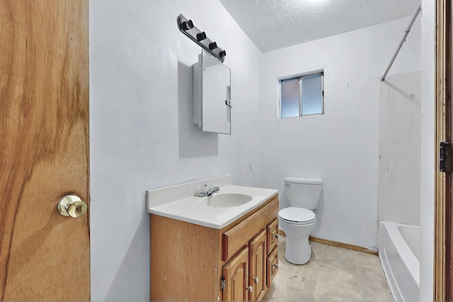 1237 Gabaldon Rd, Belen, NM 87002 - bathroom with vanity, toilet, bathtub / shower combination, a textured ceiling, and baseboards