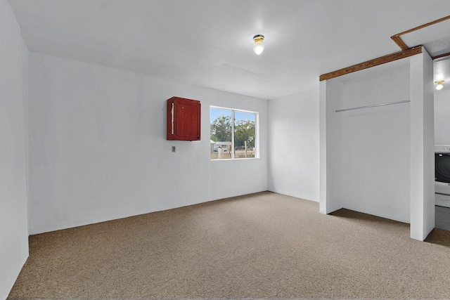 1237 Gabaldon Rd, Belen, NM 87002 - unfurnished bedroom with carpet floors, washer / clothes dryer, and a closet