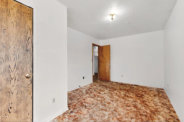 1237 Gabaldon Rd, Belen, NM 87002 - carpeted spare room with a textured ceiling and baseboards