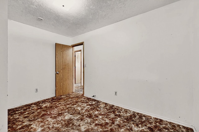 1237 Gabaldon Rd, Belen, NM 87002 - carpeted empty room with a textured ceiling and baseboards
