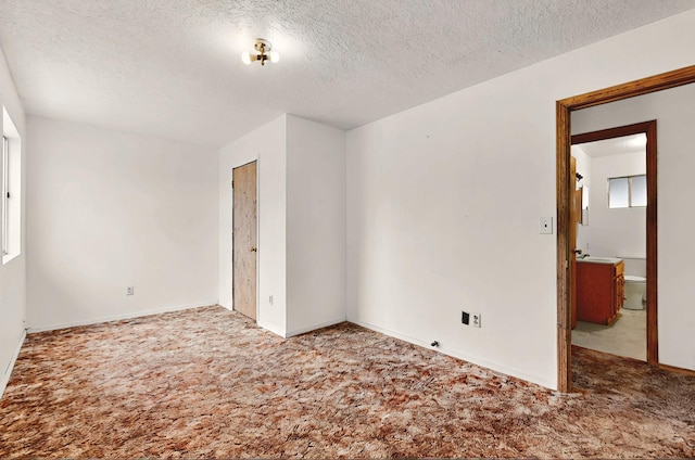 1237 Gabaldon Rd, Belen, NM 87002 - carpeted empty room featuring a textured ceiling and baseboards