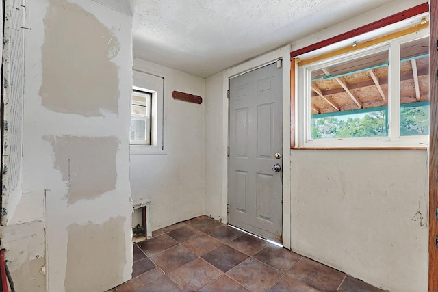 1237 Gabaldon Rd, Belen, NM 87002 - foyer entrance featuring a textured ceiling