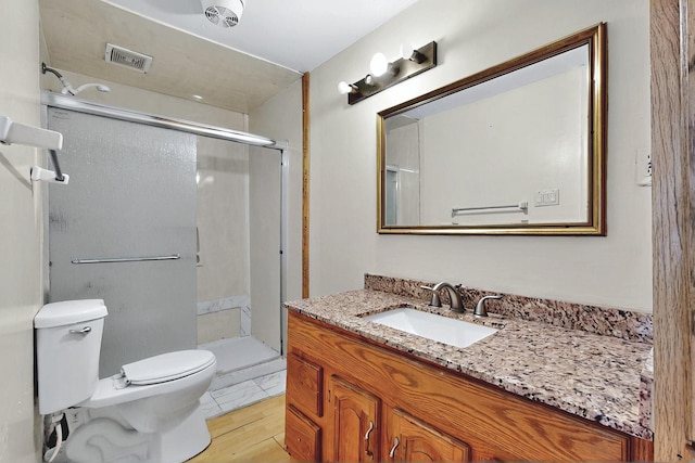 1237 Gabaldon Rd, Belen, NM 87002 - full bath featuring toilet, vanity, and a shower stall